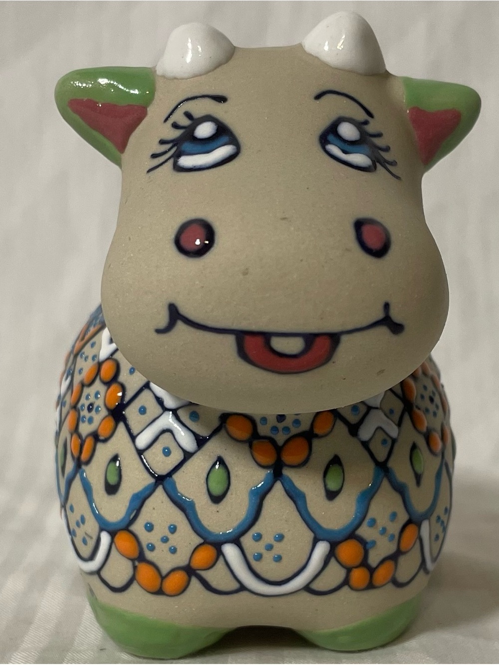 Handcrafted Ceramic Cow Figurine in Cream, Orange and Green, signed
